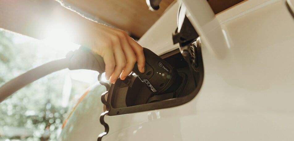 Electric vehicle charging cable being connected